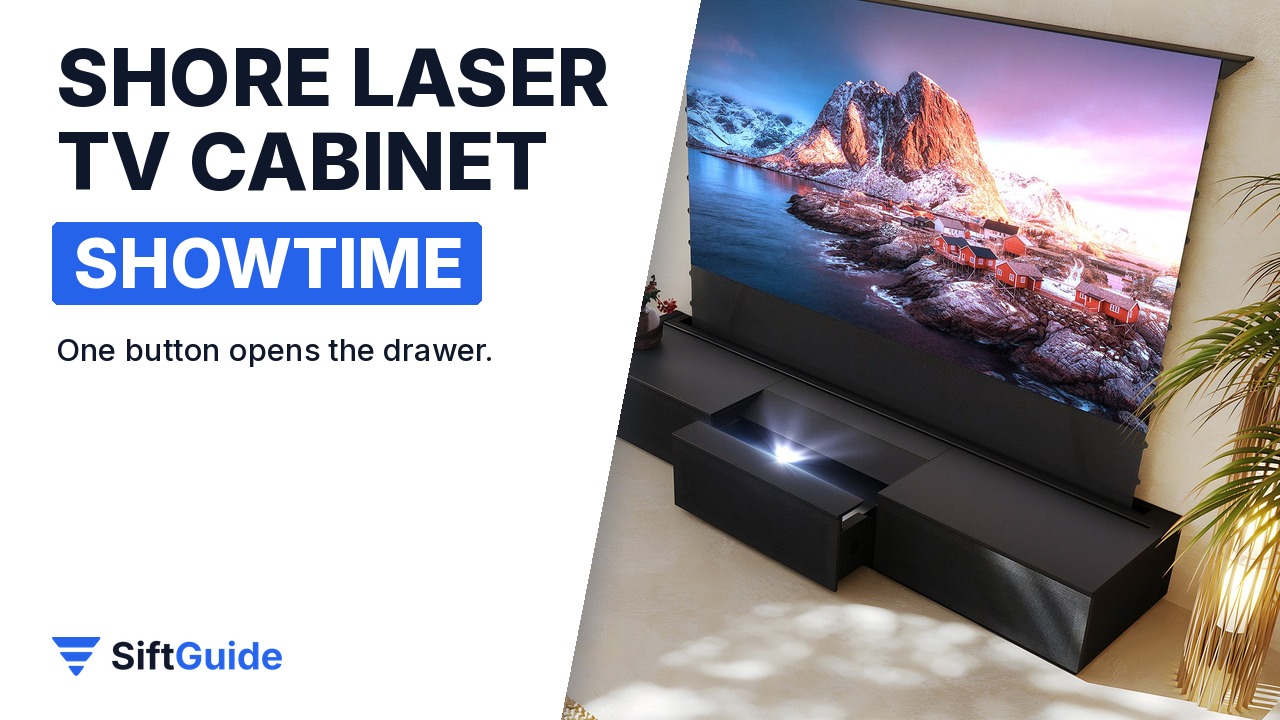 Shore black laser TV cabinet under a 100-inch floor rising screen in a living room