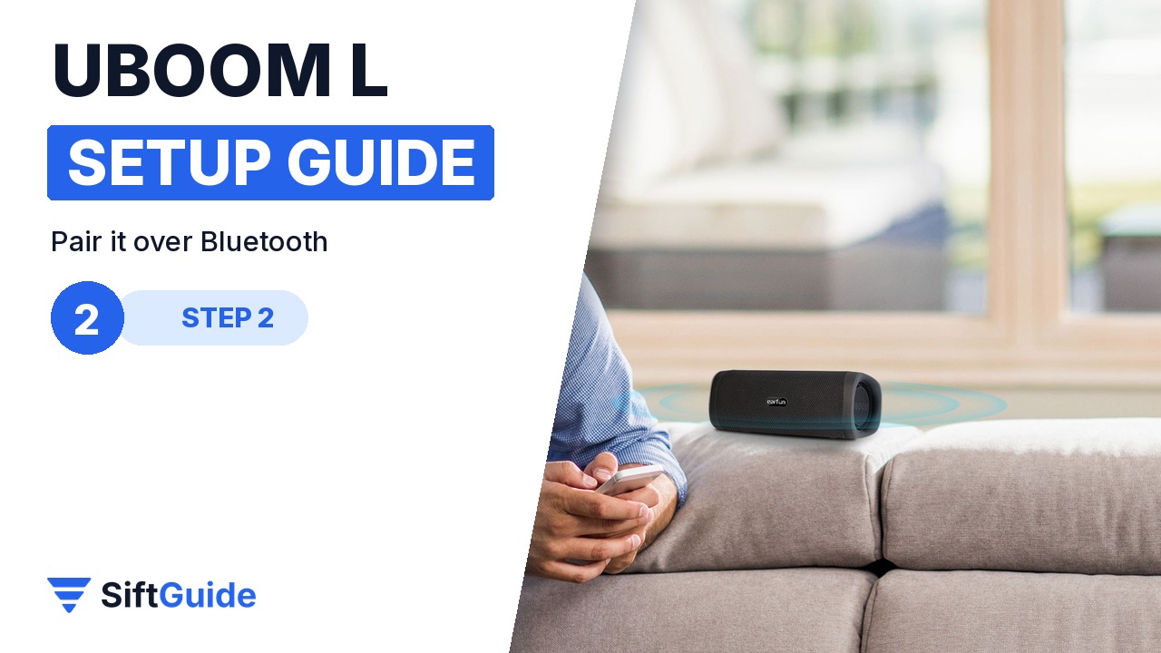EarFun UBOOM L speaker in a living room next to a phone