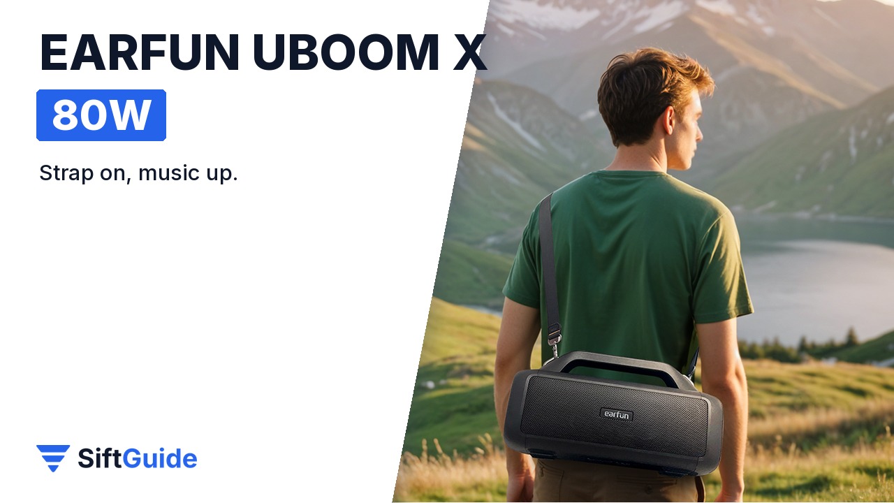Man carrying the EarFun UBOOM X on its shoulder strap by a lake
