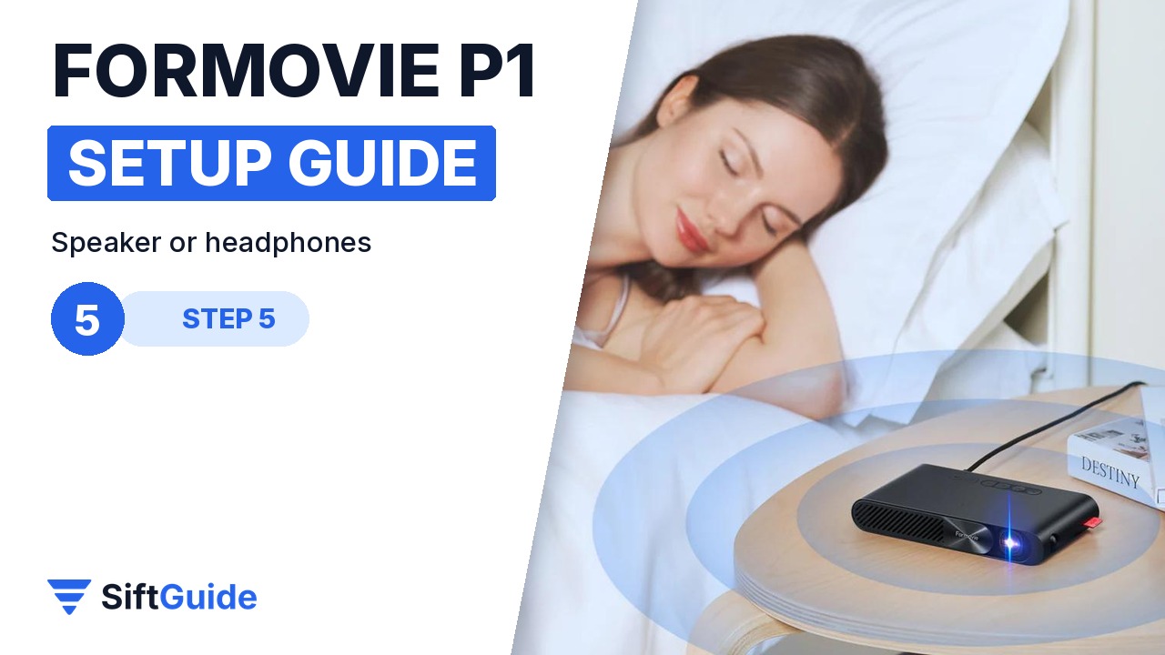 Woman lying in bed next to the Formovie P1 projecting a film for late-night viewing